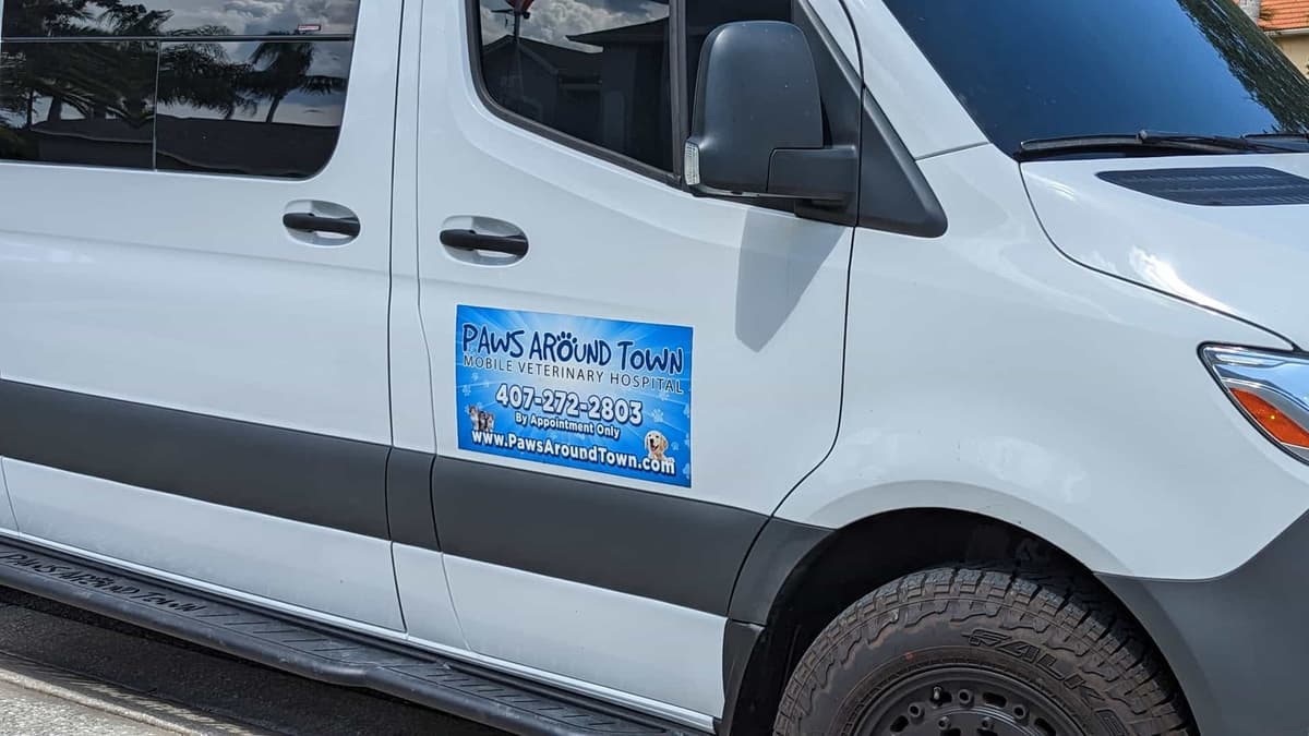 Paws Around Town mobile vet van signage